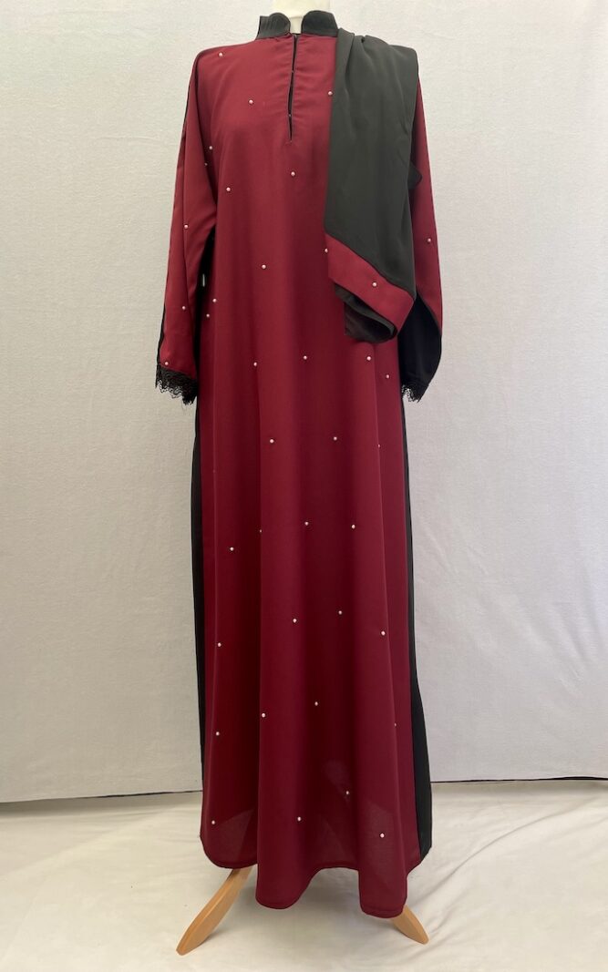 Buy this modest simple cut abaya with a burgundy coloured front that has little tiny pearls sewn across it