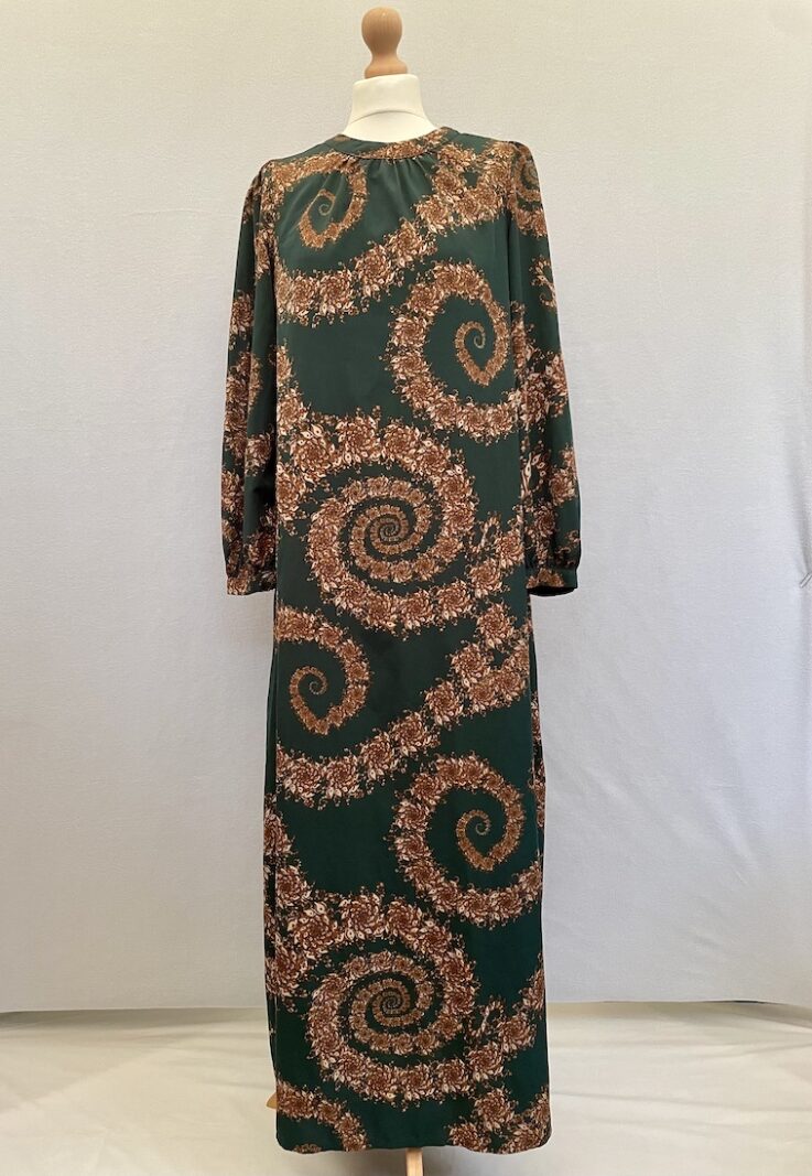 Green maxi dress with gold swirly pattern