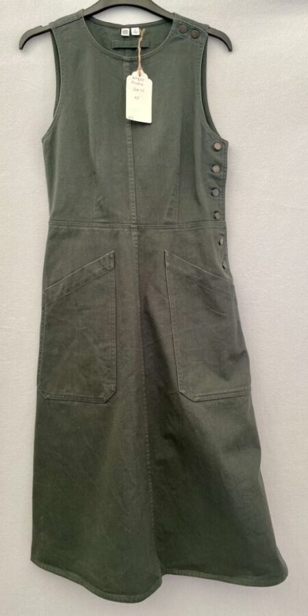 Uniqlo green denim pinafore dress with button sides and at the shoulder and two pockets at the front in size 6