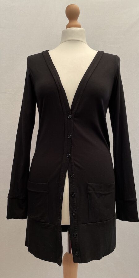 Black cardigan with button front closure and two small pockets at the front.