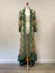 Gold net overjacket with green applique embroidery