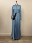 Light blue crepe-like dress with long sleeves, approx. size 16