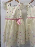 2x Jona Michelle matching girls yellow spots party dresses – full view