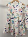 2x matching Peacocks girls party dresses – full view
