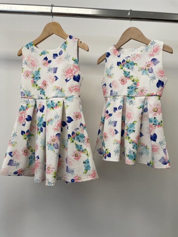 2x matching Peacocks Angel white dresses with blue and pink flowers, age 12-18m & 3-4 years