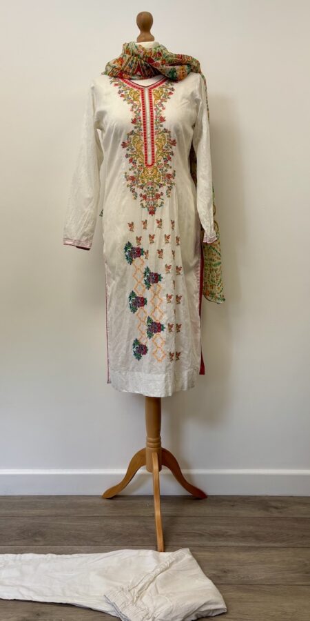 White cotton shalwar kameez with pink trim and embroidered flowers