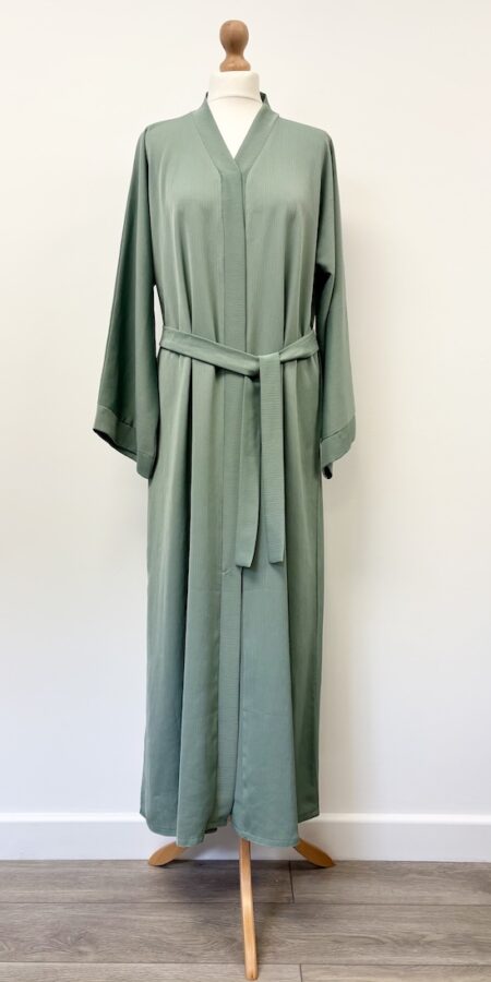 Hawaa Clothing green popper opening abaya in slight crinkle fabric, 54" long